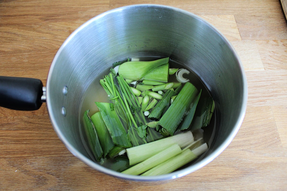lemon risotto ingredients for stock in saucepan with liquid