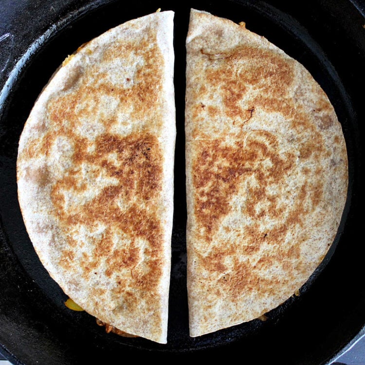 pulled chicken quesadillas in a skillet toasted