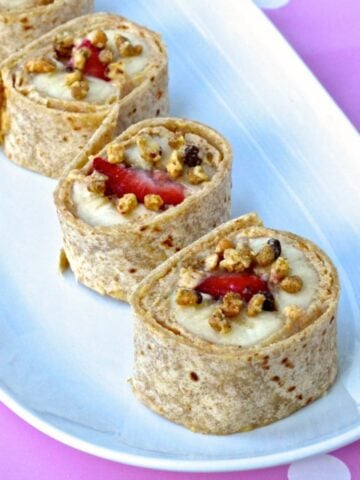 strawberry-banana-sushi-rolls-on-a-white-plate