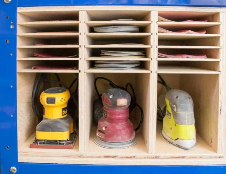 This triple sander and sandpaper storage piece fits perfectly on the lower shelf of my Kreg workbench! Get the free woodworking plans to make your own at The Handyman's Daughter!