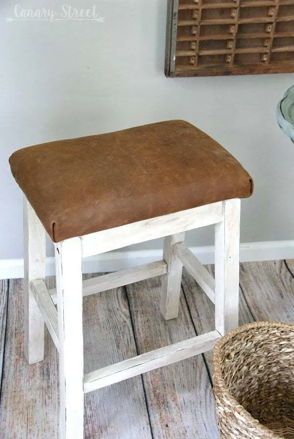 DIY leather stool with white base and brown leather cushion