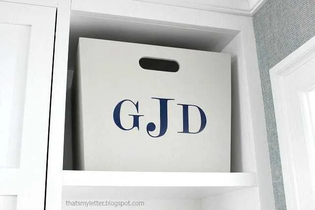 large wood bins with monogrammed initials