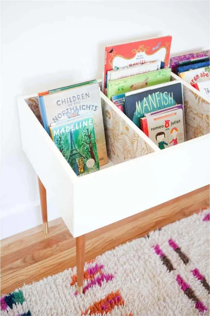 wood bin filled with childrens books