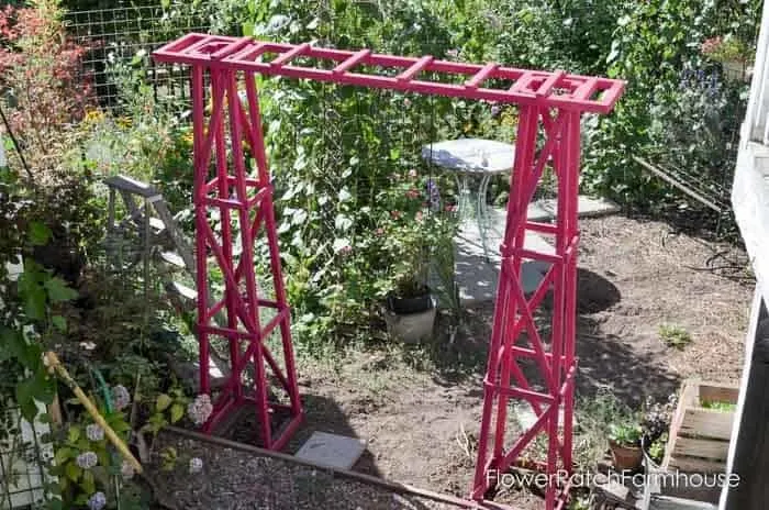 two garden obelisks connected together to form a DIY arbor