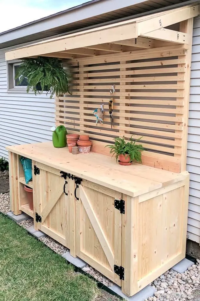 DIY potting bench with hidden garbage cans