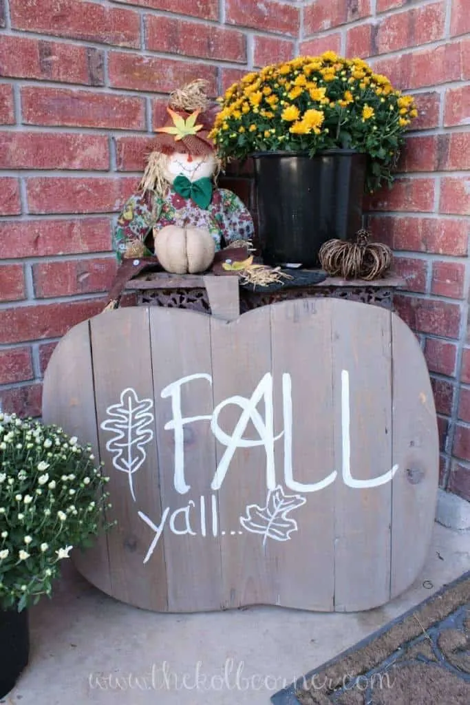 wooden pumpkin sign on front porch