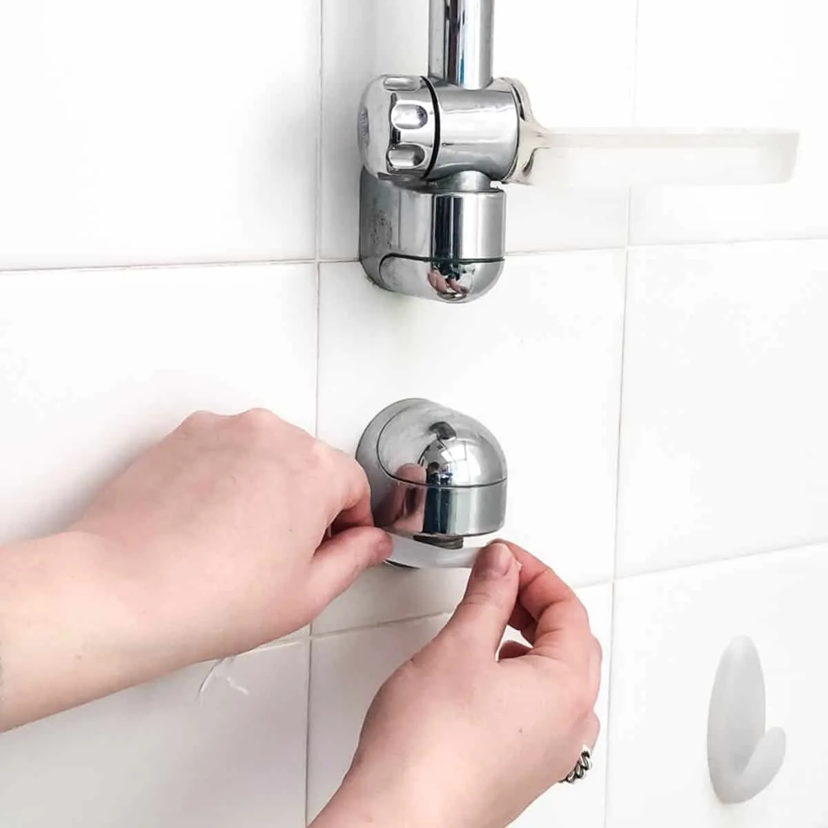 applying plumbers tape to threads
