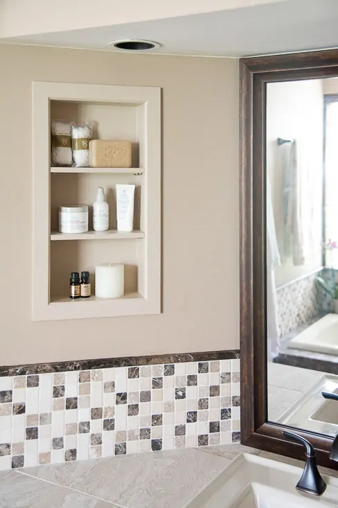 recessed bathroom shelves above vanity countertop