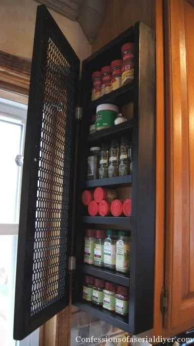 shallow spice cabinet attached to side of kitchen cabinets