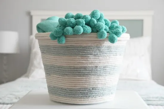 blanket storage idea - rope basket made from a laundry basket