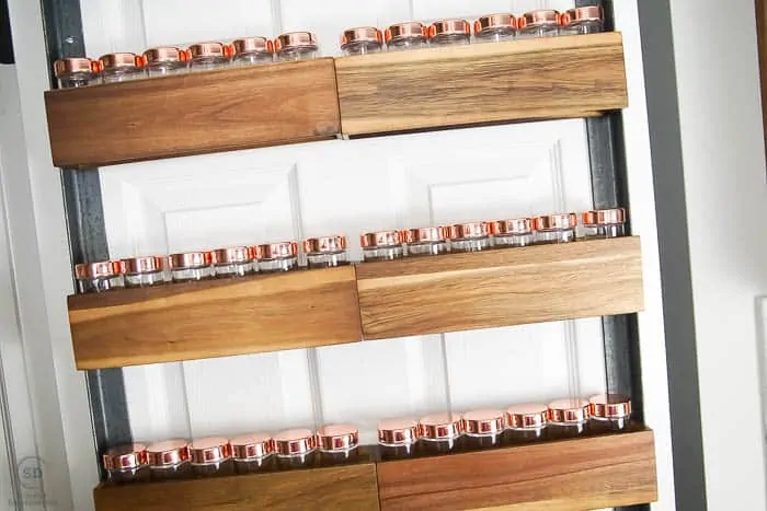 DIY spice rack on back of pantry door