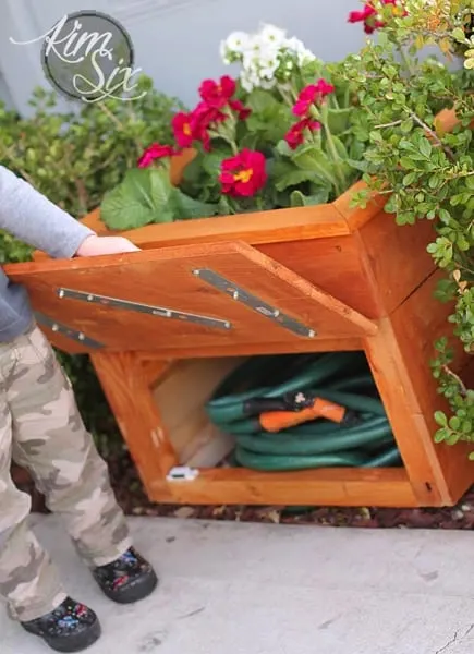 garden hose hidden in planter box