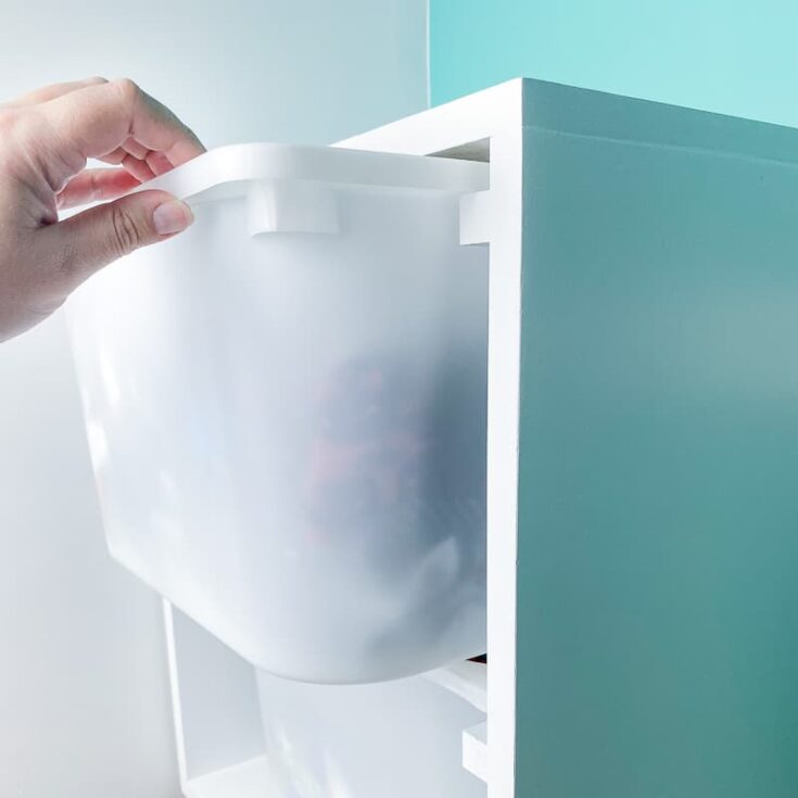 wall mount storage bin pulled out of frame