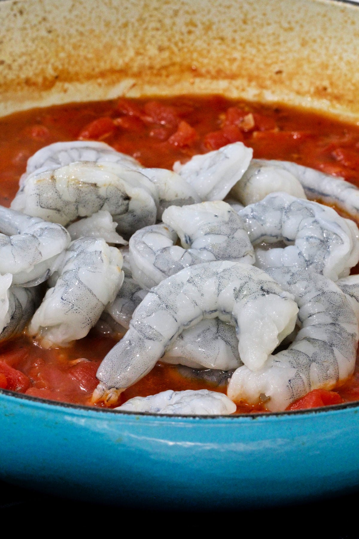 raw shrimp added to skillet