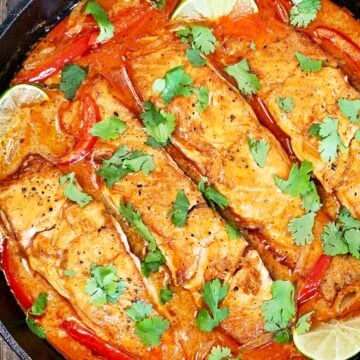 Thai salmon curry in a cast iron skillet