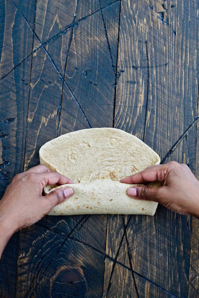 rolling up the burrito