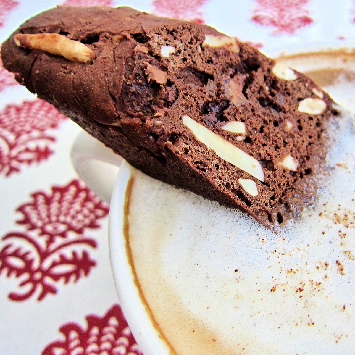 biscotti dipped into a cappuccino.