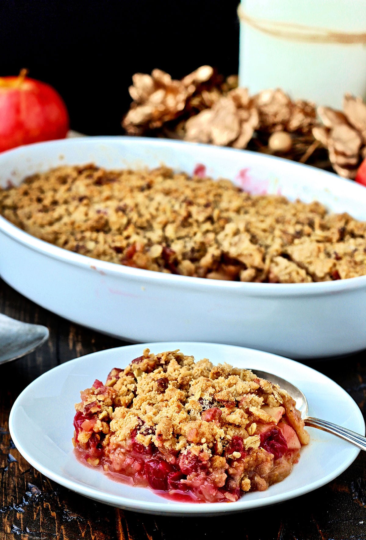 Piece of Apple cranberry crisp on a white dish