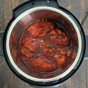 Homemade bbq sauce in slow cooker with chicken.