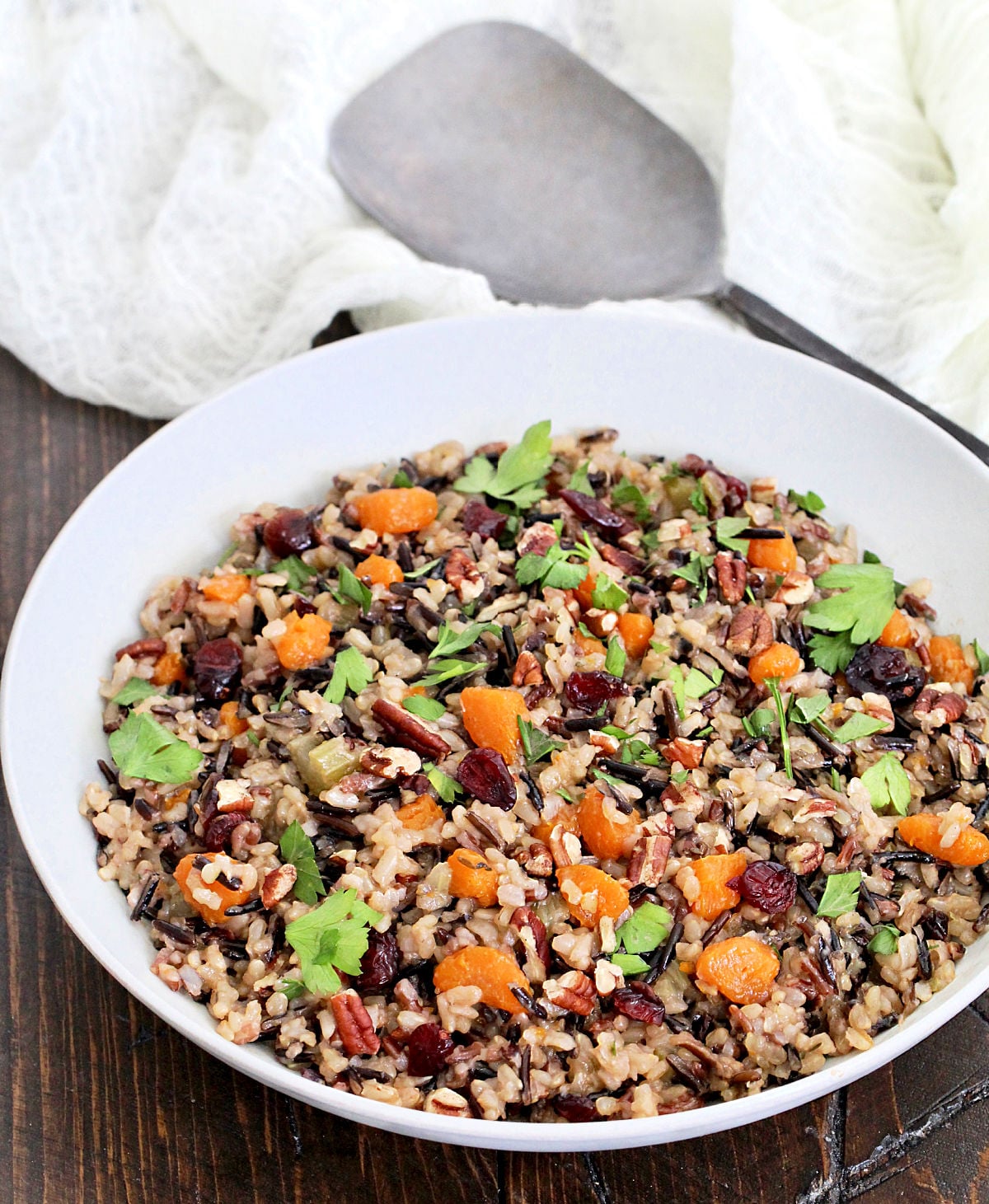 Wild rice pilaf in a white bowl.