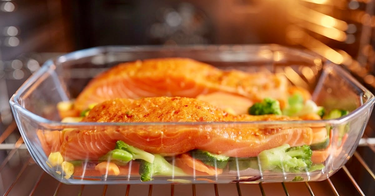 Salmon baking in glass dish. 