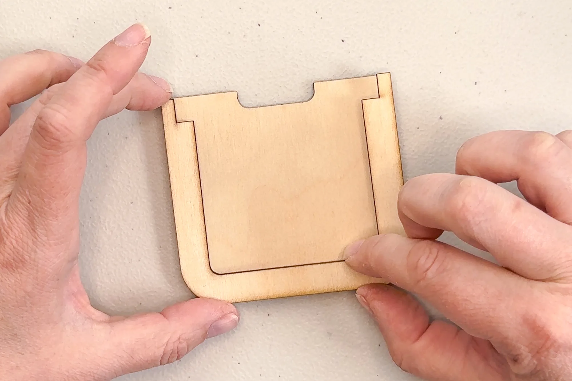 attaching the bottom spacer to the back of the gift card holder