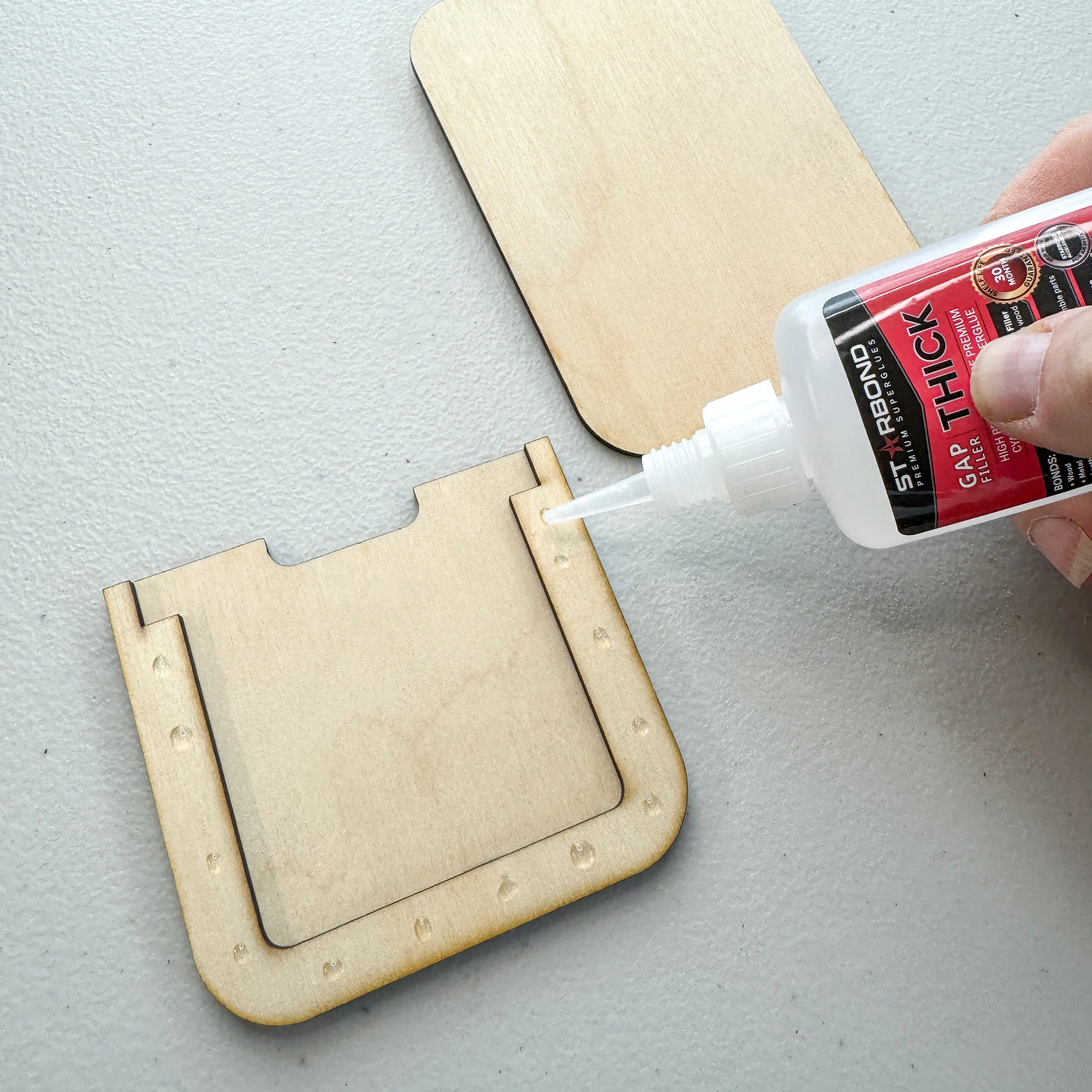 gluing the bottom spacer before attaching the front of the gift card holder