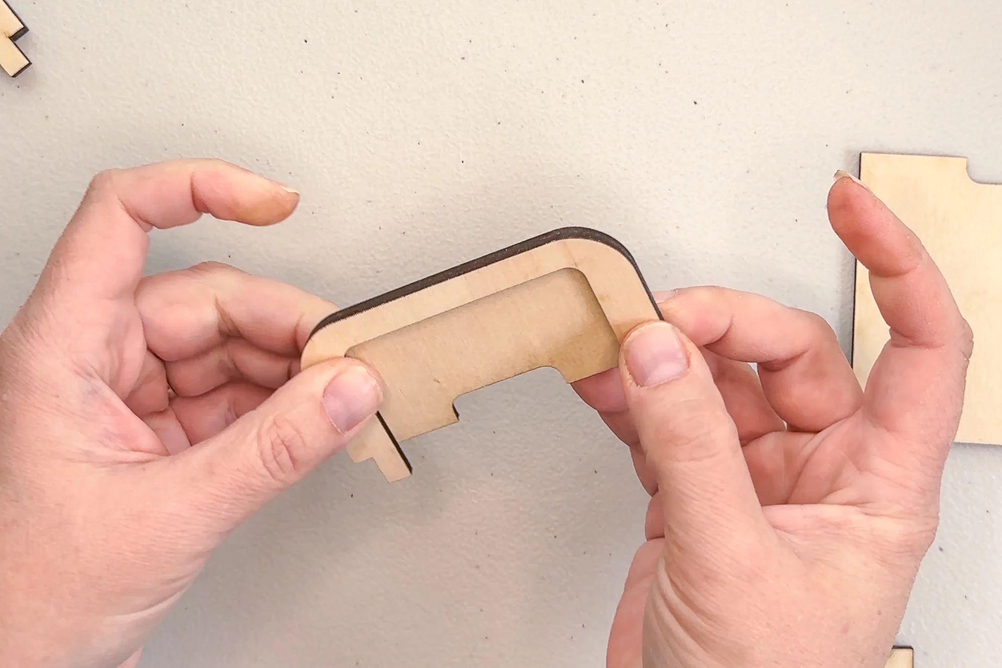 aligning the edges of the top back piece of the gift card holder