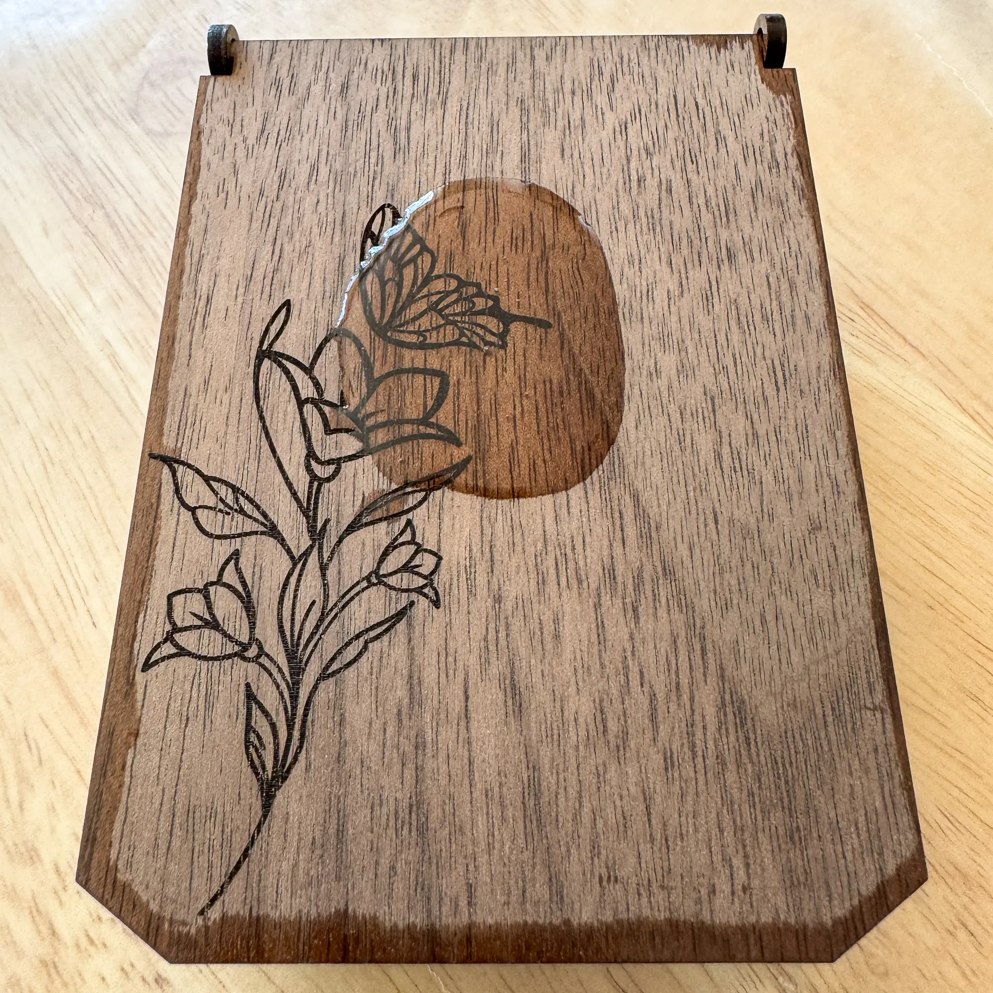 applying mineral oil to walnut wood jewelry box lid