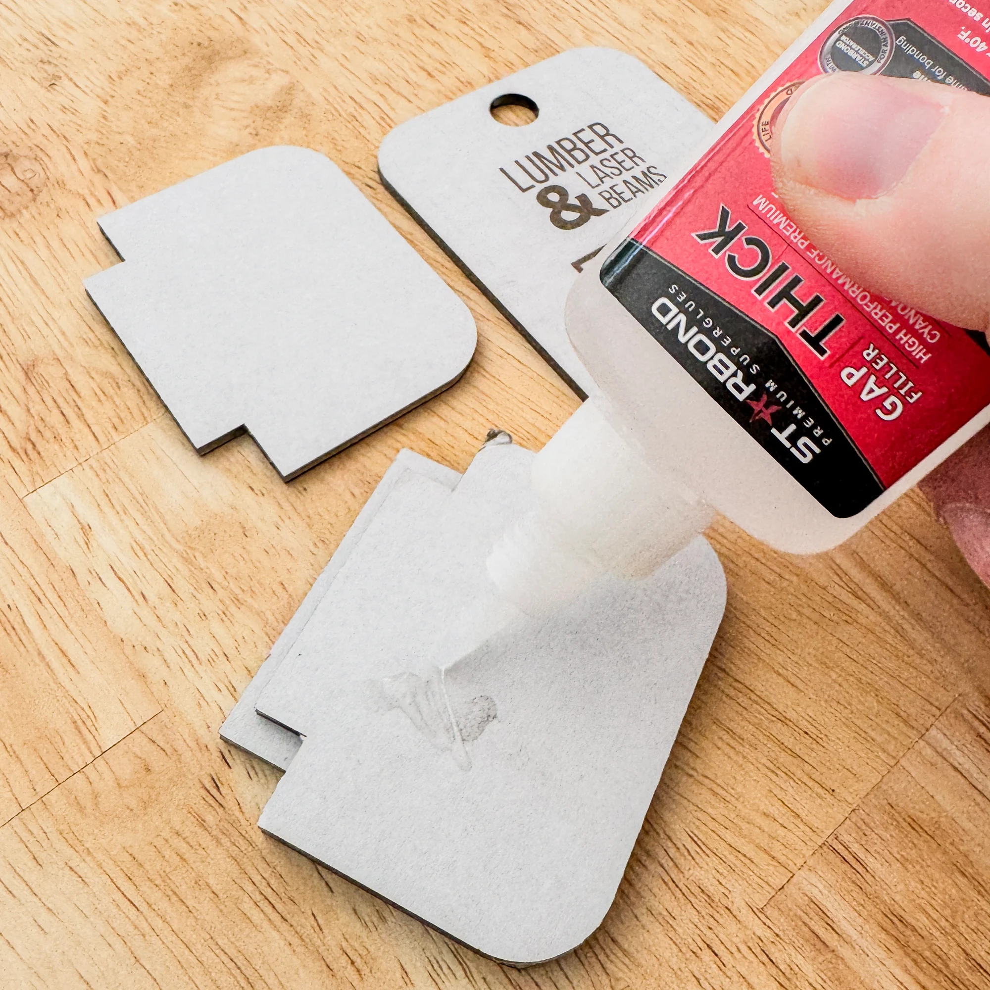 gluing bottom half of packaging